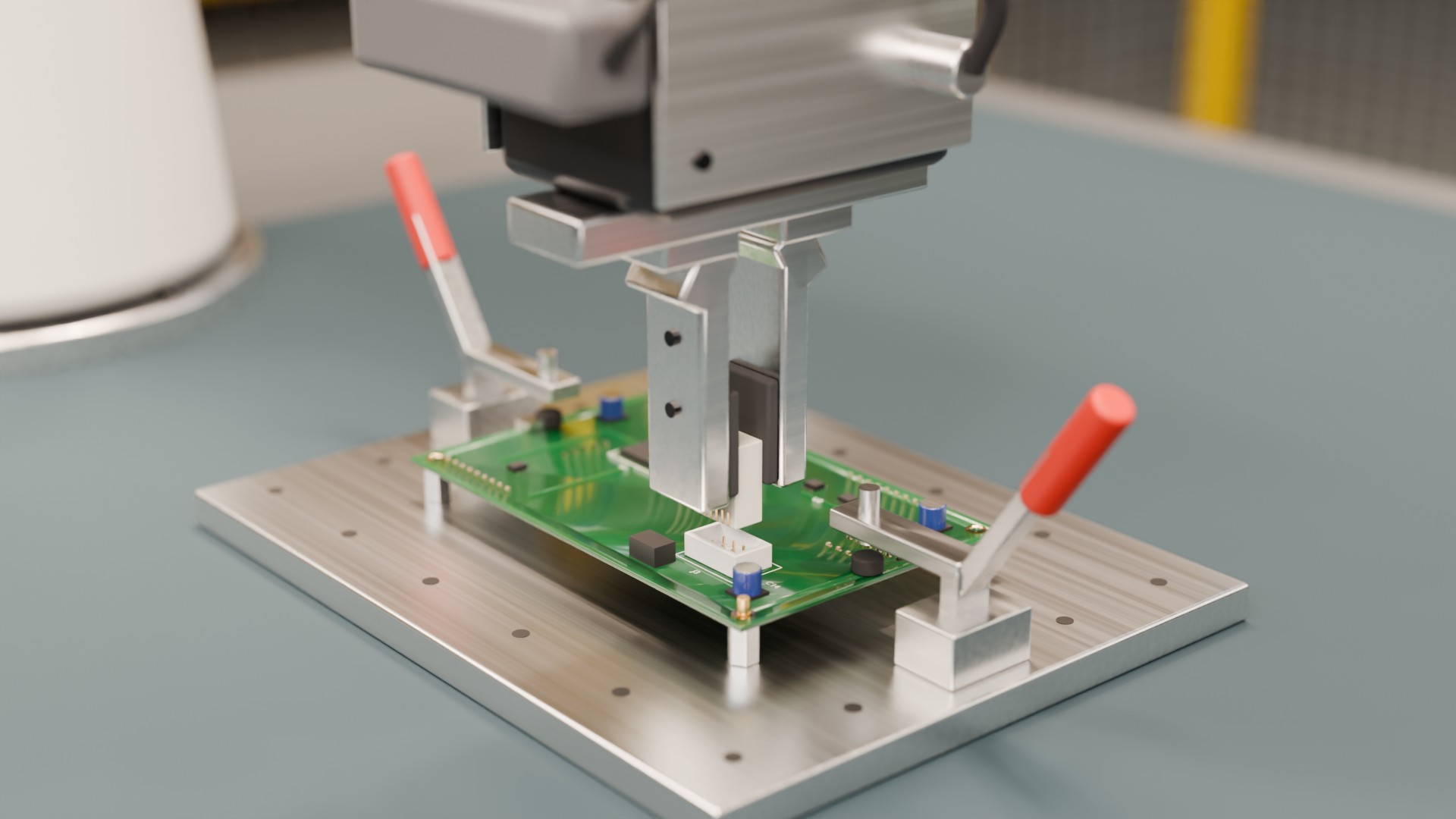 The gripper holding a connector above its receptacle on a green circuit board clamped in an aluminium fixture